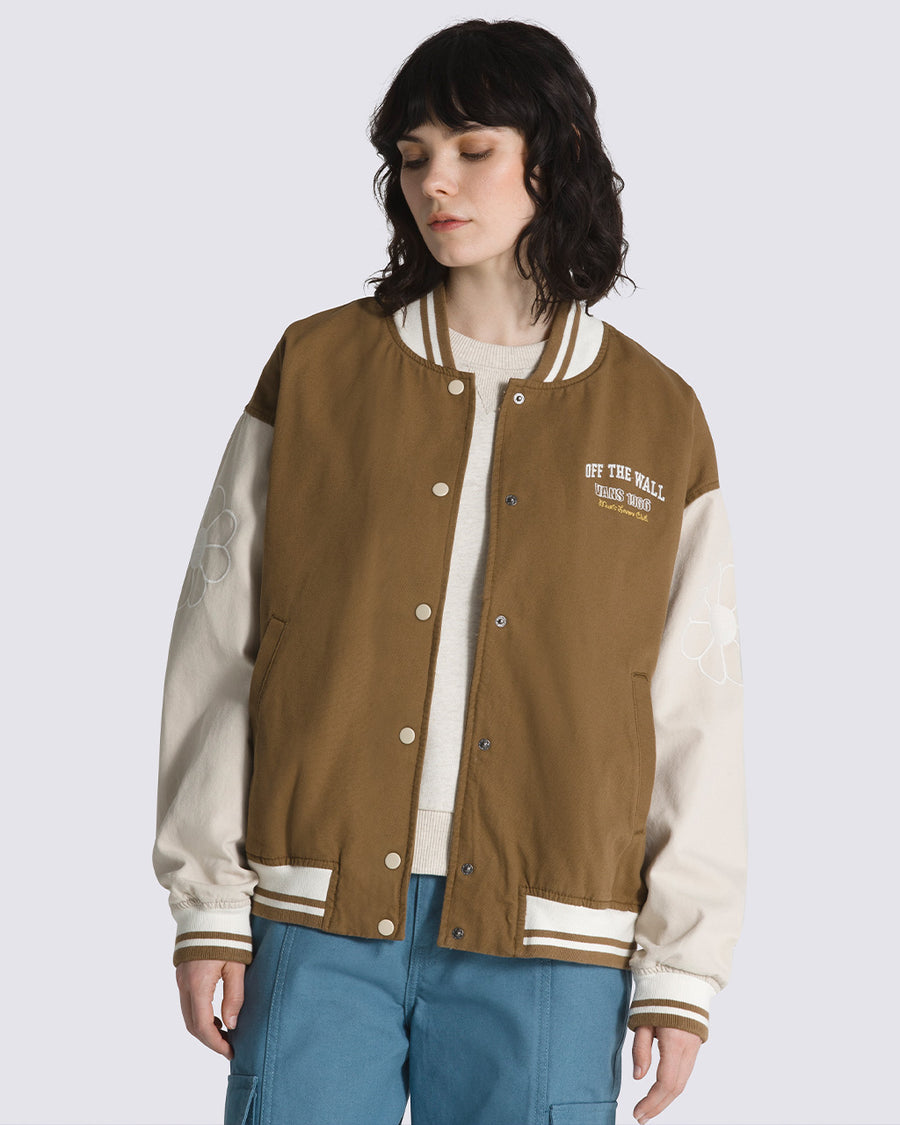 brown retro bomber jacket with floral detail on sleeve and 'off the wall vans 1966 music lovers club' on the chest