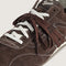 up close of brown vans super low pro trainer sneakers  with white and brown  laces