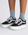 model wearing blue vans crew socks with white accents
