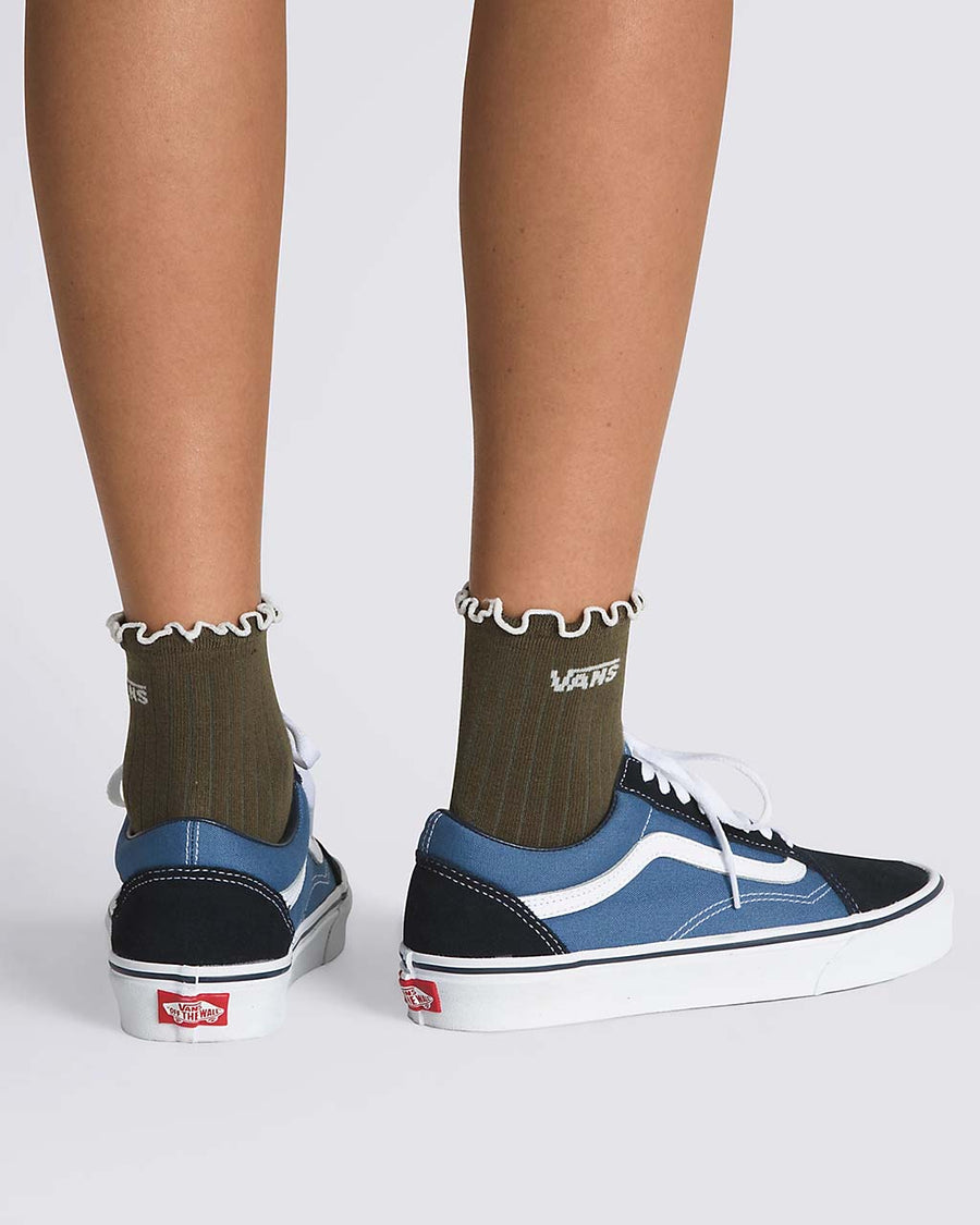 model wearing green/brown vans crew socks with white accents