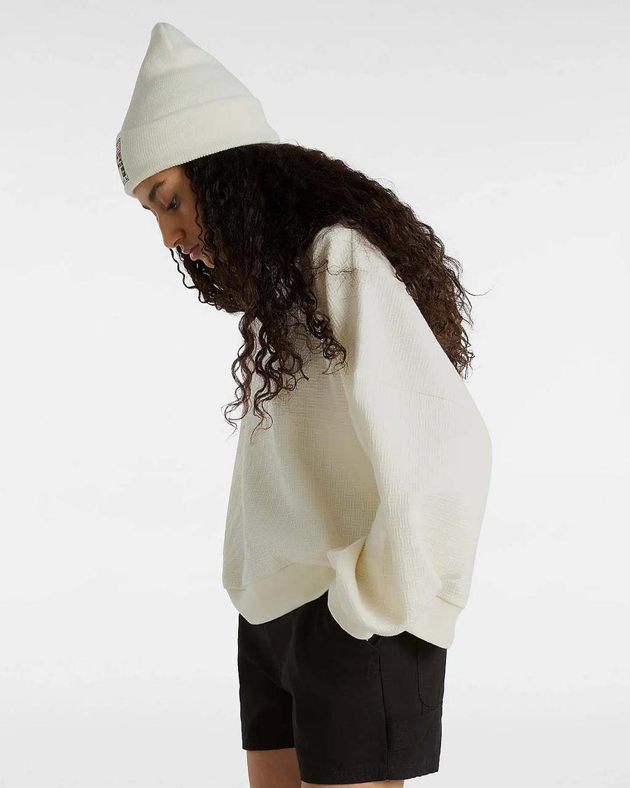 side view of model wearing marshmallow textured crew neck sweatshirt