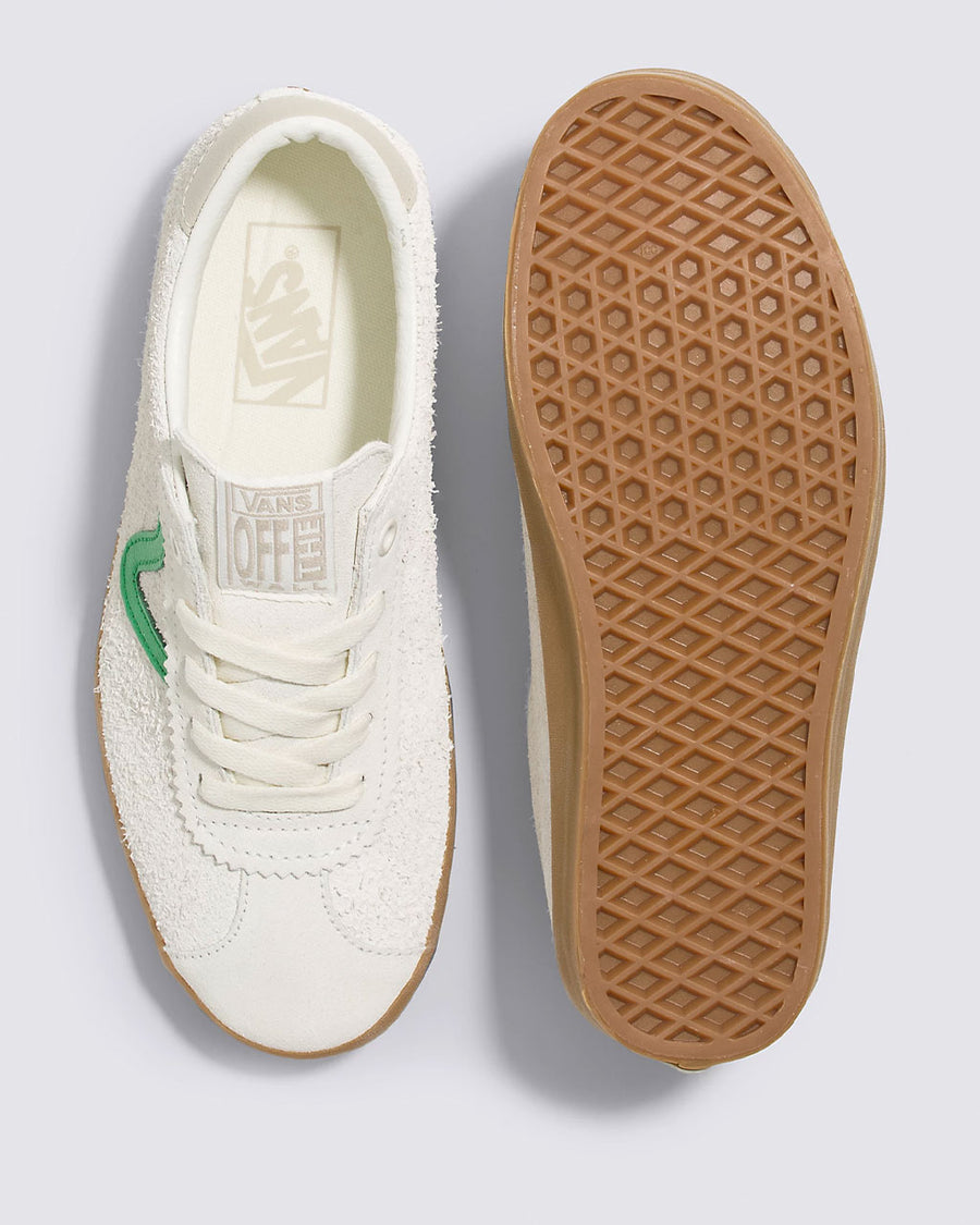 top and bottom view of white vans sport low sneakers with green iconic vans stripe