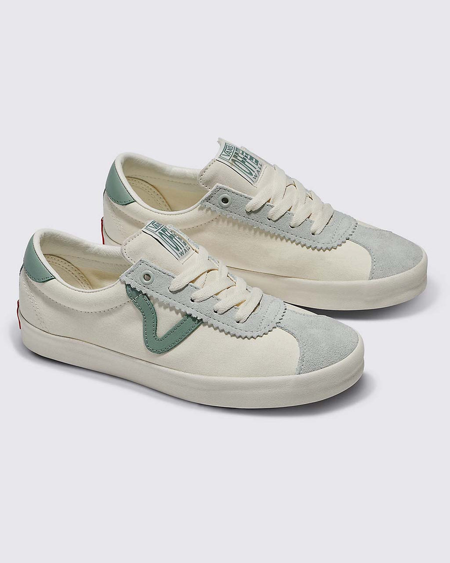 cream sneakers with slate blue and green accents