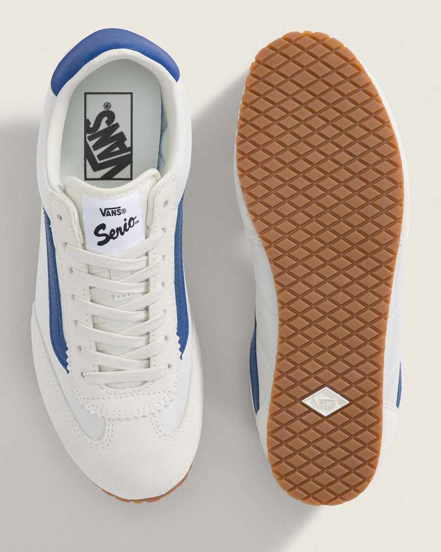 top and bottom view of white vans super low pro sneaker with royal blue trim and iconic stripe