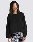 model wearing black cropped sweatshirt with hi-lo hem, kangaroo pocket, and blouson sleeves