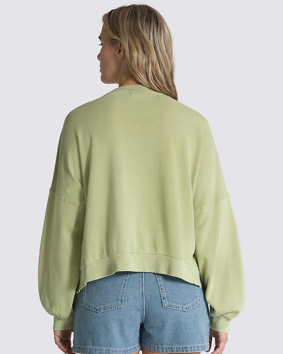backview of model wearing winter pear cropped sweatshirt with hi-lo hem, kangaroo pocket, and blouson sleeves