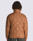 back view of model wearing brown quilted cropped jacket