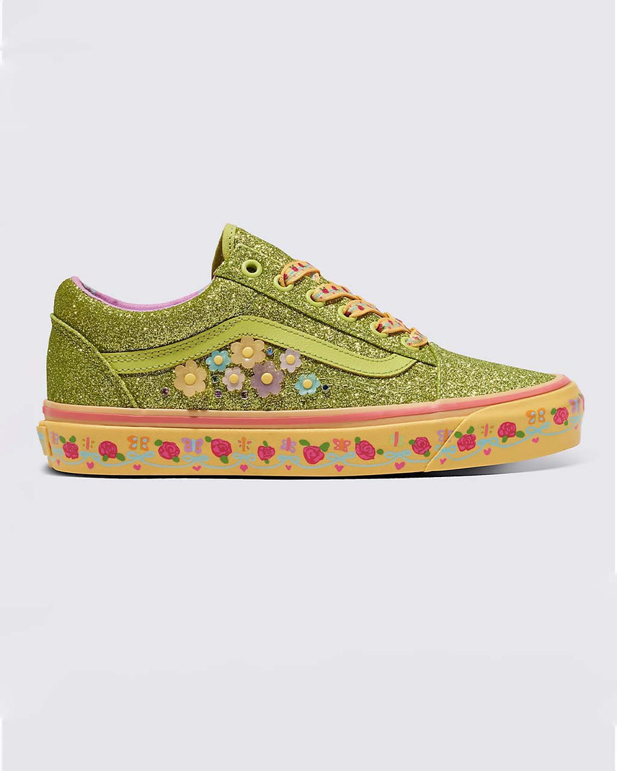 green sparkly sneaker with flower detail and yellow sole with floral print