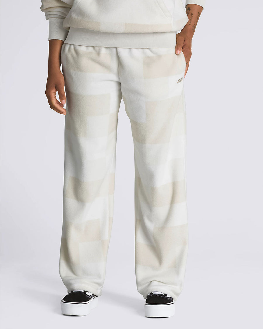model wearing tan and white checker sweatpants
