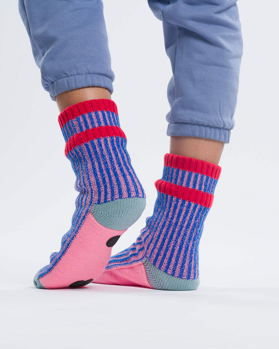 back view of pink and blue ribbed socks with pink and grey bottom with non-stick bottoms