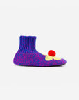 side view of blue and magenta marled slippers with yellow flower and red pom top