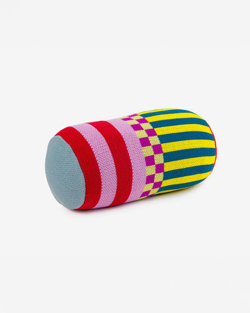 multicolored bolster pillow with various stripes and checkered print