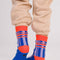 back view of blue and lilac stripe socks with bright red trim