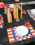 set of 4 jade and cobalt checkered placemats on table