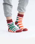 model wearing multi stripe house socks