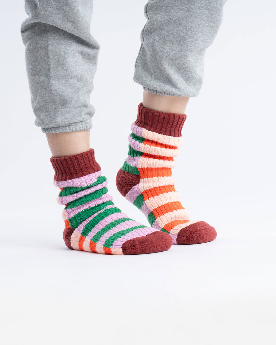 model wearing multi stripe house socks