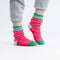 model wearing pink and and green colorblock varsity house socks