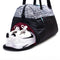 shoe compartment of duffle bag with black and white leopard top and black bottom