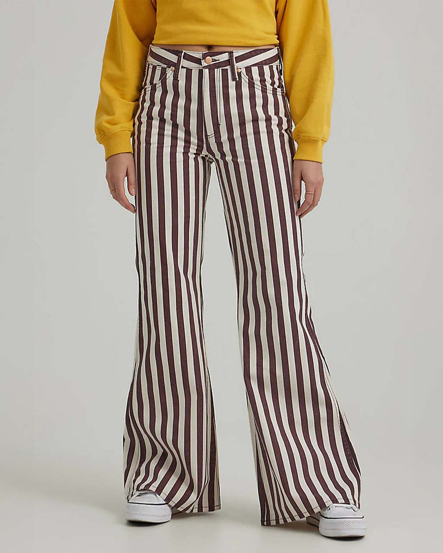 front view of model wearing brown/purple and white vertical stripe flared jeans