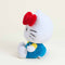 side view of hello kitty wearing blue overalls and yellow top with her iconic red bow warmie plush