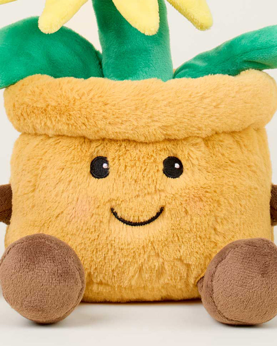 up close of pot on smiley potted sunflower warmies heating plush