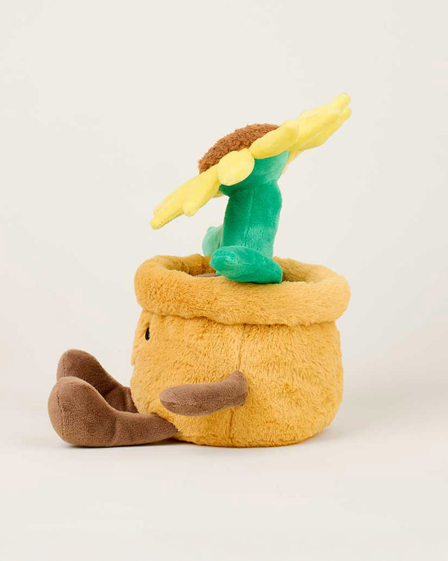 side view of smiley potted sunflower warmies heating plush