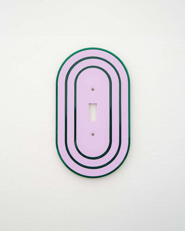 lilac toggle light switch cover with dark green accent color