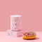 pink terrazzo portable mug next to a donut