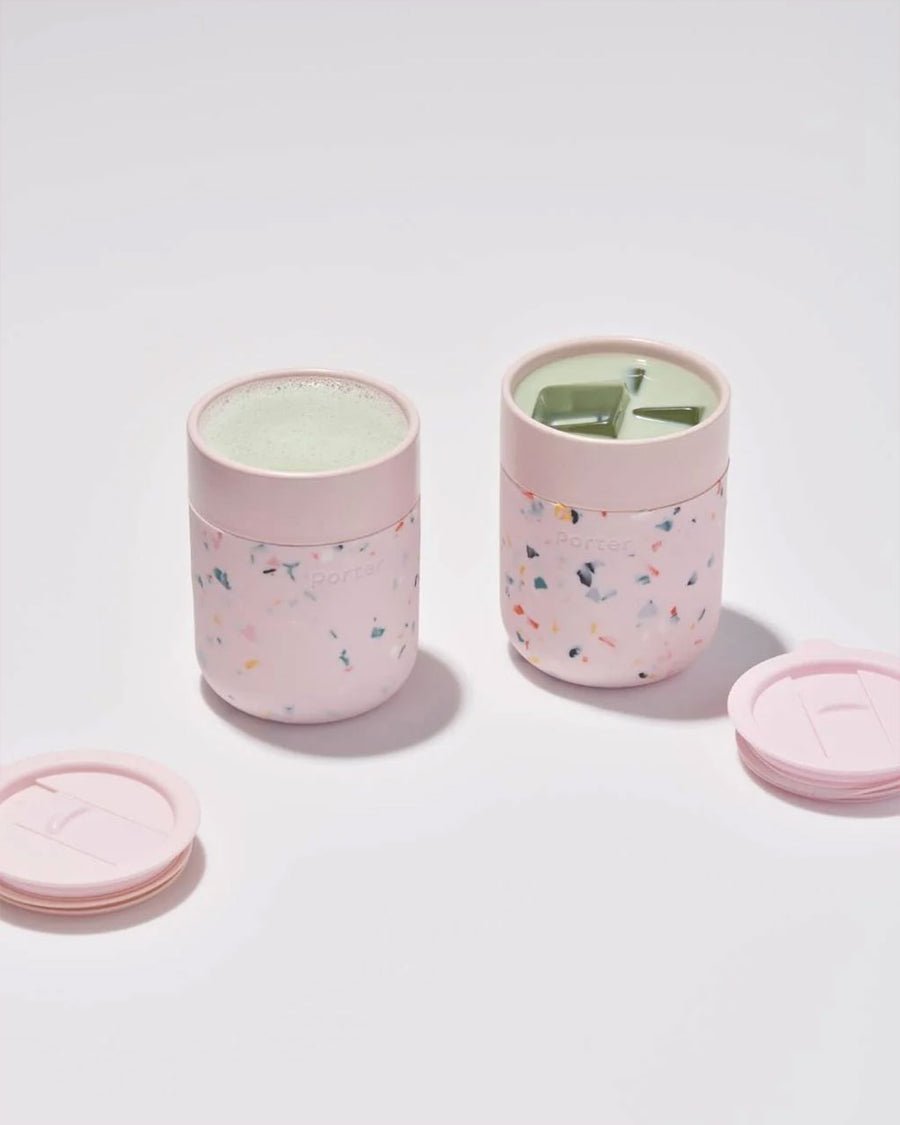 two pink terrazzo portable mugs with matcha inside