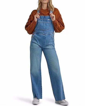 model wearing relaxed fit denim overalls
