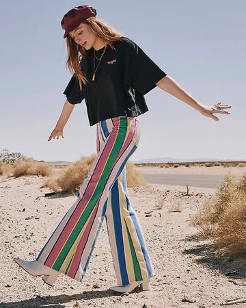 model wearing multicolor vertical stripe flared pants