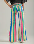 back view of model wearing multicolor vertical stripe flared pants