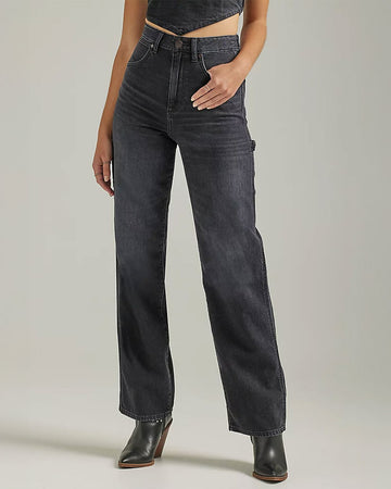 model wearing dark grey carpenter jeans