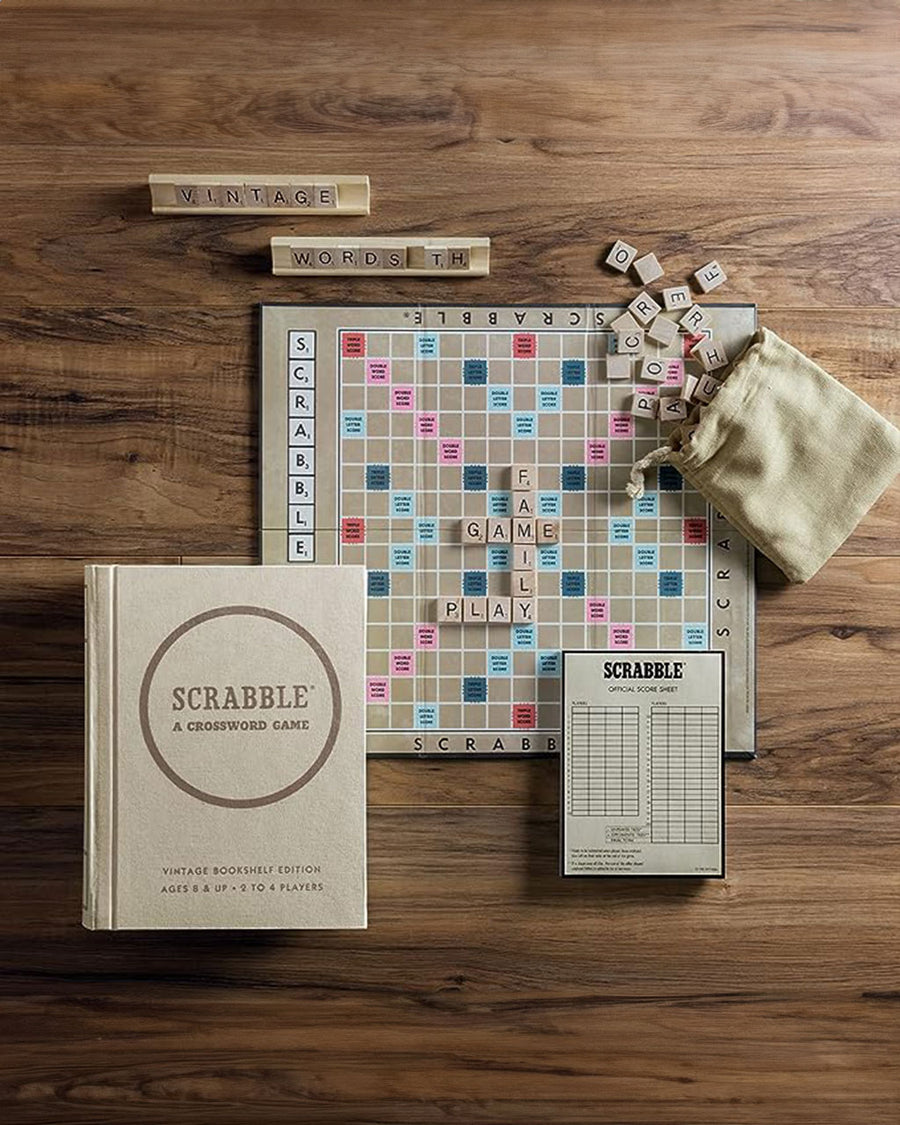 board and pieces in vintage scrabble game with bookshelf cover