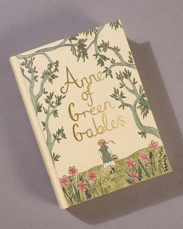 hardcover anne of green gables book on a table