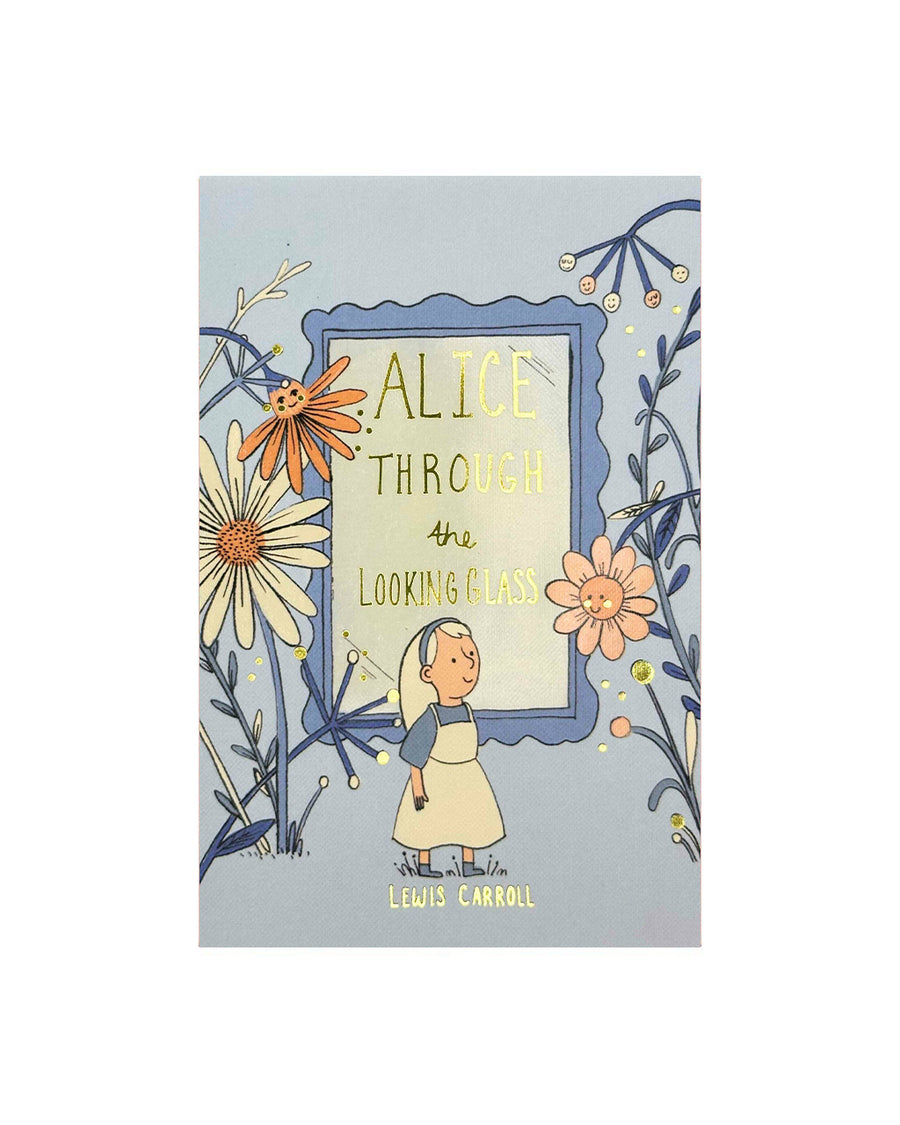 hardcover alice through the looking glass book on a white ground