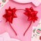 two red bows on the side of a headband