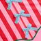 up close of pink and red stripe tree skirt with three baby blue bows down the front and kelly green trim