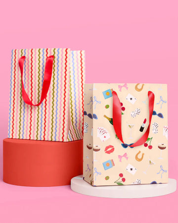set of 6 gift bags (3 of each design) cream with colorful wavy vertical stripes and cream with cute girly icons