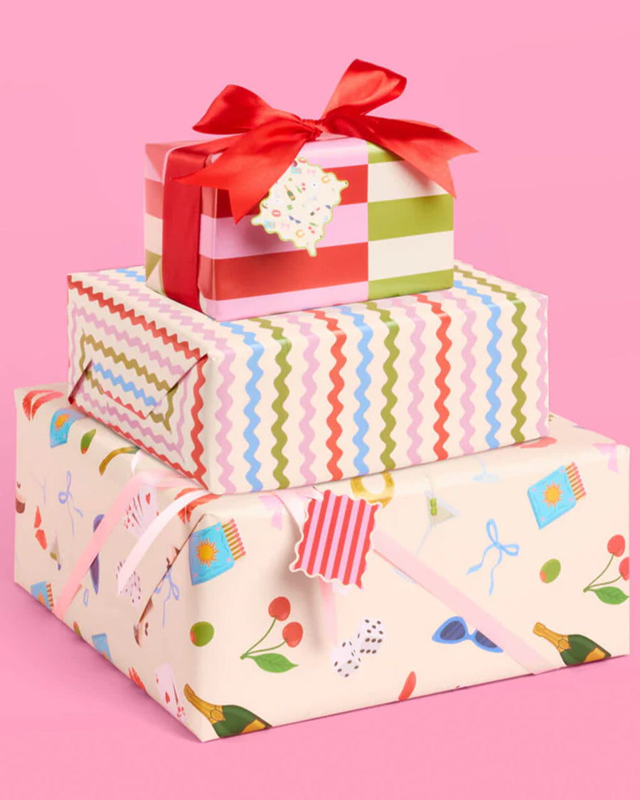 wrapping paper set with 16 double sided tags; 8 with stripes + 8 with all over icons