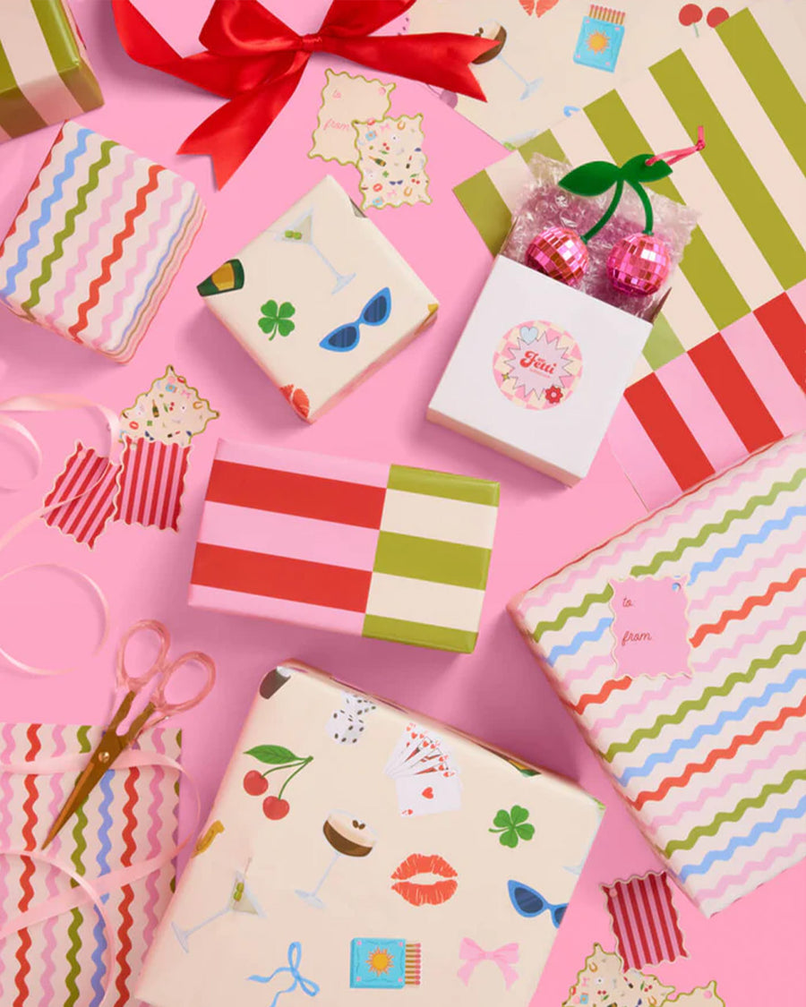 wrapping paper set with 16 double sided tags; 8 with stripes + 8 with all over icons