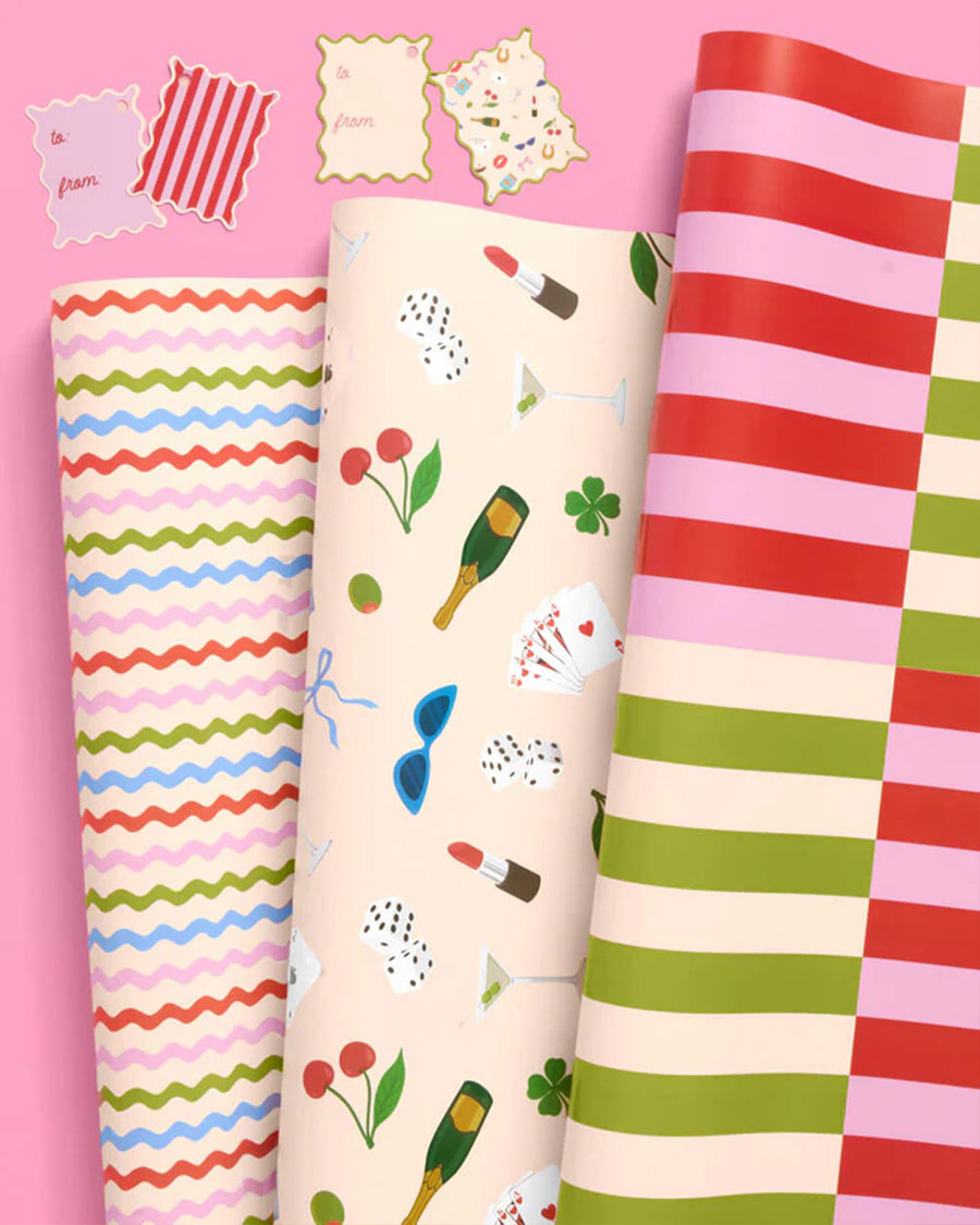 folded wrapping paper set with 16 double sided tags; 8 with stripes + 8 with all over icons