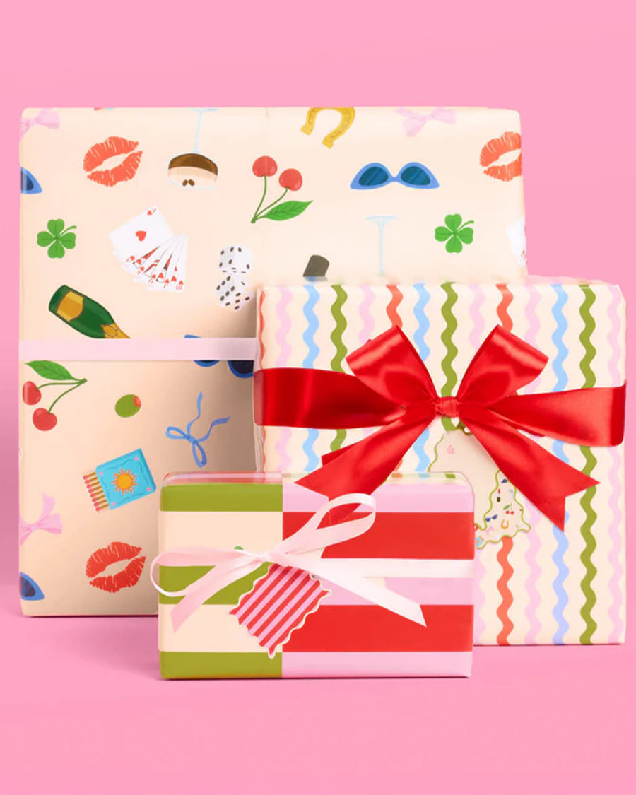 wrapped wrapping paper set with 16 double sided tags; 8 with stripes + 8 with all over icons