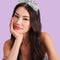 model wearing silver tinsel, disco ball and star headband