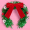green tinsel headband with red velvet bow and ornaments