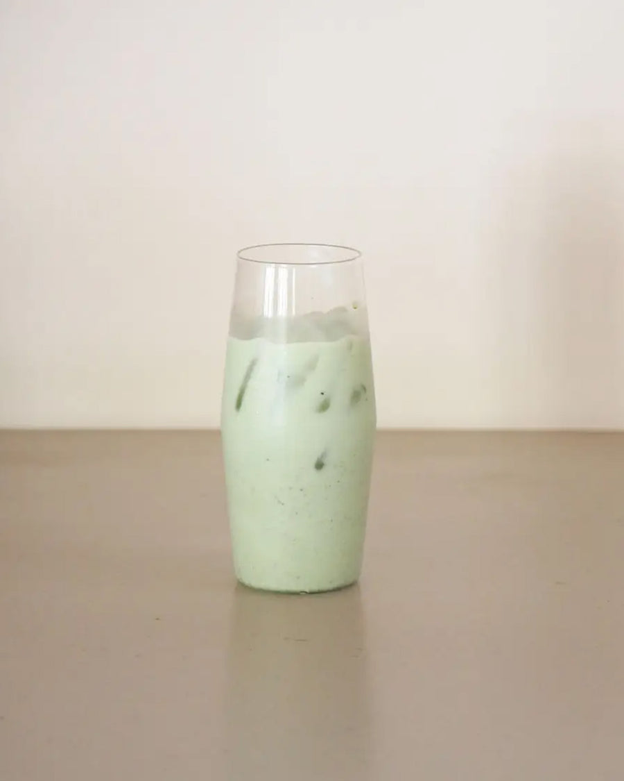 clear glass with a light green beverage inside