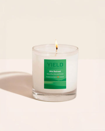 Headspace X YIELD Mini Retreat Candle with notes of pine, citrus, and firewood