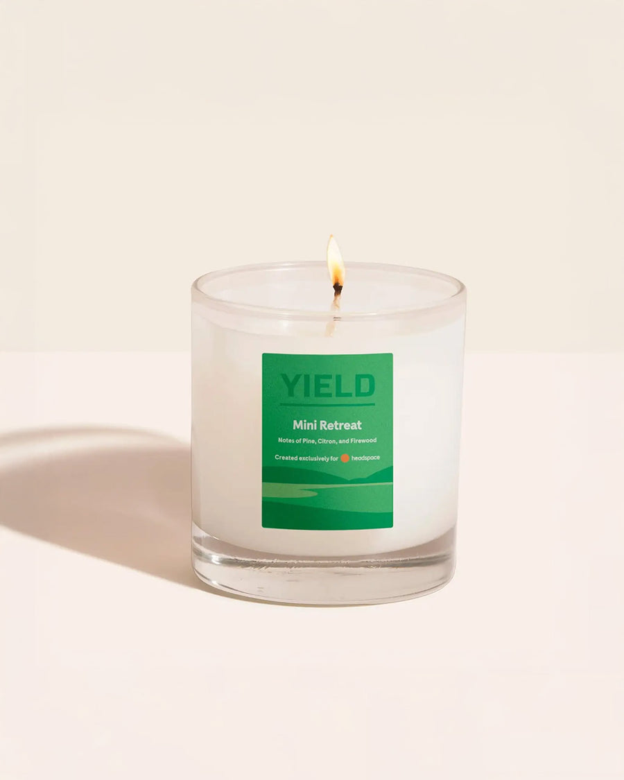 Headspace X YIELD Mini Retreat Candle with notes of pine, citrus, and firewood