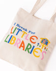 up close of canvas 'i break for little libraries' tote bag