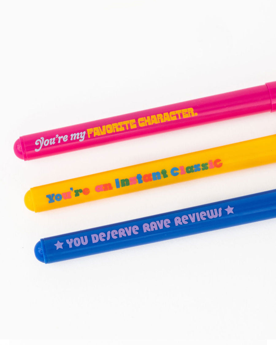 up close of set of three pens with book sayings: you're my favorite character', you're an instant classic', and 'you deserve rave reviews'